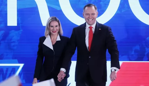 epa12149868 Polish presidential candidate Karol Nawrocki (R) with his wife Marta Nawrocka (L) during the presidential election night in Warsaw, Poland, 01 June 2025. According to an exit poll conducted by Ipsos for TVN24, TVP and Polsat News, Rafal Trzaskowski won 50.3 percent, while Karol Nawrocki won 49.7 percent. EPA/Leszek Szymanski POLAND OUT