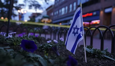 epa12150110 An Israeli flag in a flowerbed near the scene of an incident in Boulder, Colorado, USA, 01 June 2025. Boulder police stated in a press conference that six members of the public have been injured in what the FBI has described as a 'targeted terror attack'. EPA/REBECCA SLEZAK