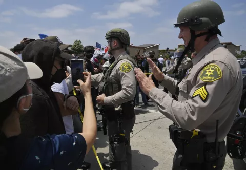 Protestors face off with California Highway Patrol officers during a protest against ICE and immigration raids on the Alvarado Boulevard Long Beach (710) Freeway in Paramount, California on Saturday, June 7, 2025. The Trump administration said it would send 2,000 National Guard troops into Los Angeles after a second day in which protesters confronted immigration agents during raids of local businesses. Photo by Jim Ruymen Photo via Newscom Photo: Jim Ruymen/NEWSCOM