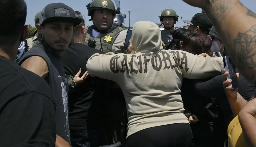 Protestors face off with Los Angeles County Sheriff deputies during a protest against ICE and immigration raids on the Alvarado Boulevard Long Beach (710) Freeway in Paramount, California on Saturday, June 7, 2025. The Trump administration said it would send 2,000 National Guard troops into Los Angeles after a second day in which protesters confronted immigration agents during raids of local businesses. Photo by Jim Ruymen Photo via Newscom Photo: Jim Ruymen/NEWSCOM
