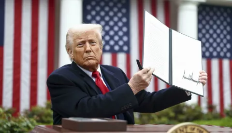 US President Donald Trump holds up a signed executive order implementing new reciprocal tariffs against US trading partners in the Rose Garden of the White House in Washington, DC, USA, 02 April 2025. Trump has branded the day 'Liberation Day', though most economists expect US consumers to foot the costs.Credit: Jim LoScalzo/ Pool via CNP/AdMedia Photo: CNP/AdMedia/NEWSCOM