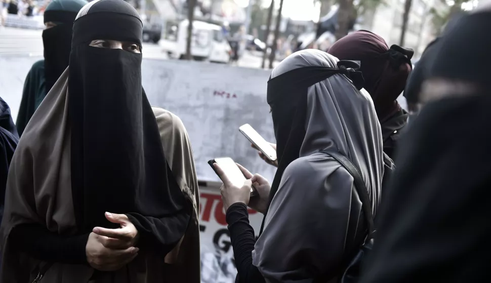 epa06922070 Face covered women protest in Copenhagen, Denmark, 01 August 2018, on the first day of the implementation of the Danish face veil ban. Under the new law, all apparel covering the face is forbidden in public places. This includes wearing burka, niqab, full-face balaclavas, hats, caps, scarves, masks, helmets, full-length suits and artificial beards. EPA/Mads Claus Rasmussen DENMARK OUT