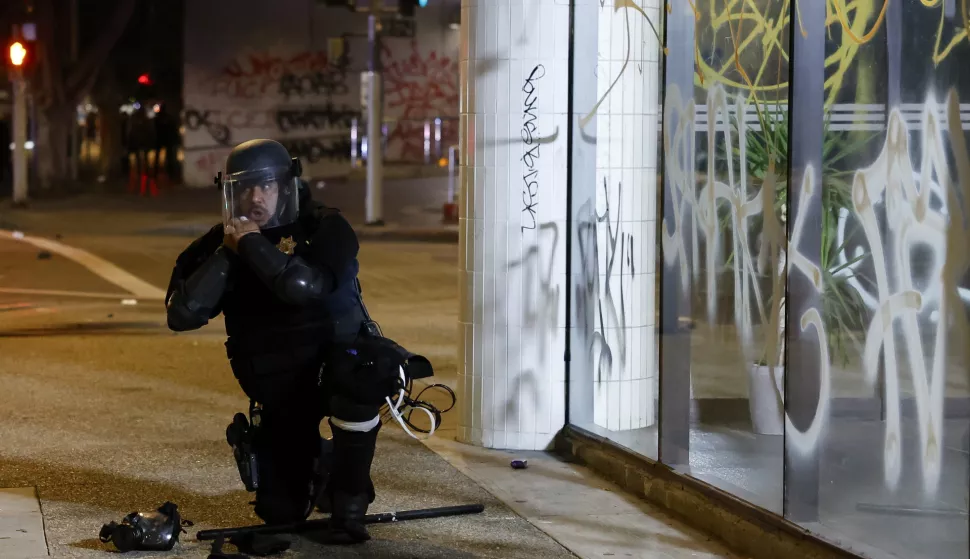 epa12167480 A police officer puts on riot gear during protests in Los Angeles, California, USA, 09 June 2025. The US president on 09 June mobilized Marines and additional National Guard troops amid large protests against ongoing immigration enforcement raids in the Los Angeles area, despite not receiving a request from the state of California for any additional assistance. EPA/CAROLINE BREHMAN