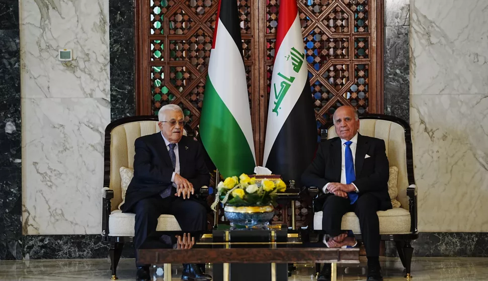 epa12105967 Iraqi Foreign Minister Fuad Hussein (R) welcomes Palestinian President Mahmoud Abbas (L) upon arrival at Baghdad International Airport, Iraq, 16 May 2025, ahead of the 34th Arab League summit. EPA/MURTADHA AL-SUDANI/POOL