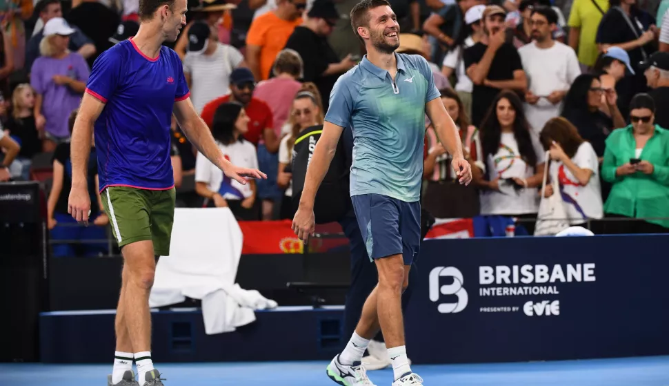 epa11800834 Michael Venus (R) of New Zealand and Nikola Mektic (L) of Croatia react after winning their doubles match against Novak Djokovic of Serbia and Nick Kyrgios of Australia at the Brisbane International tennis tournament in Queensland Tennis Centre in Brisbane, Australia, 01 January 2025. EPA/JONO SEARLE AUSTRALIA AND NEW ZEALAND OUT