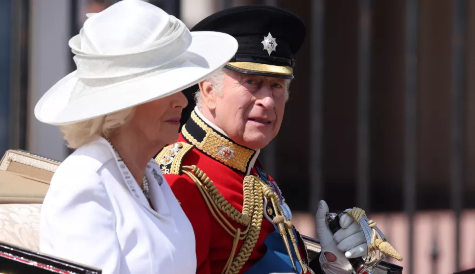 epa12174784 Britain's King Charles III (R) and Queen Camilla (L) ride in a carriage during the Trooping the Colour ceremony in London, Britain, 14 June 2025. The King's birthday parade, traditionally known as Trooping the Colour, is a ceremonial military parade to celebrate the official birthday of the British sovereign. EPA/NEIL HALL
