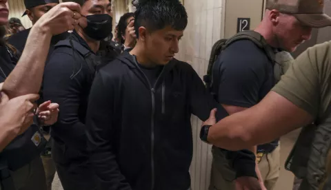 epa12170378 Federal agents detain a person (C) after he attended an immigration court hearing at Jacob K. Javits Federal Building in New York, New York, USA, 11 June 2025. ICE has increased their enforcement following mandatory check-ins at immigration court hearings after the Trump administration ordered officials to increase detentions to 3,000 migrants per day. EPA/SARAH YENESEL