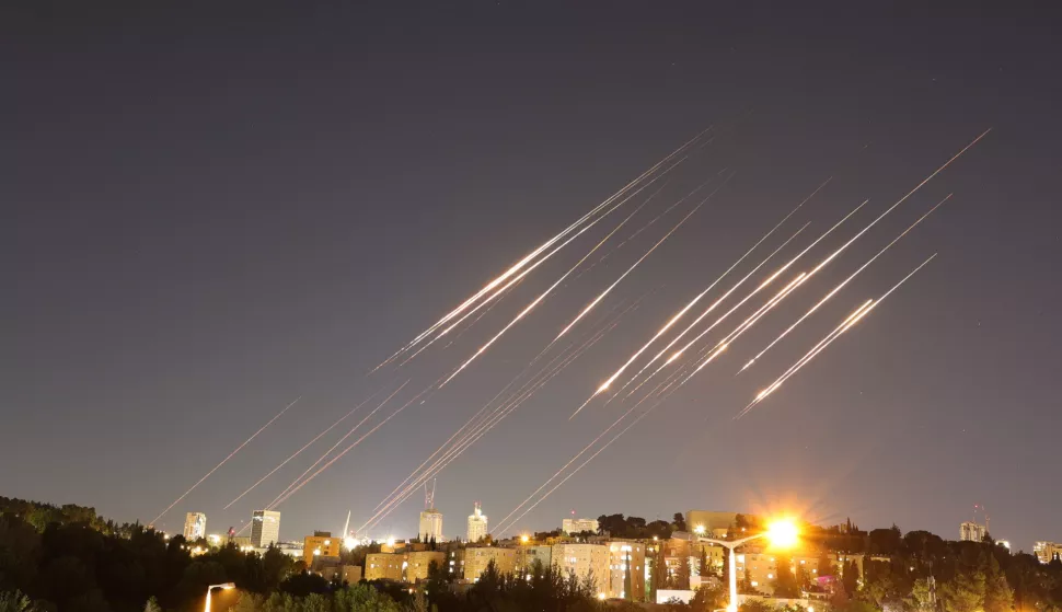 epa12175801 A slow exposure picture shows ballistic missiles above Jerusalem, 14 June 2025. Israel's military has identified missiles being launched from Iran towards the territory of Israel in retaliation following overnight airstrikes on Iranian targets. EPA/ABIR SULTAN