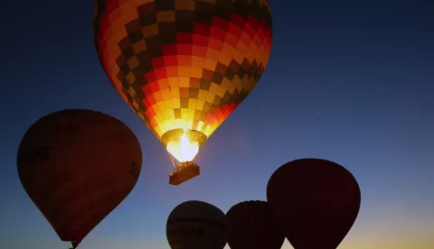 epa07185904 Workers prepare hot air balloons for take-off before an early morning flight at a launch site in Luxor, Egypt, 24 November 2018. EPA/KHALED ELFIQI