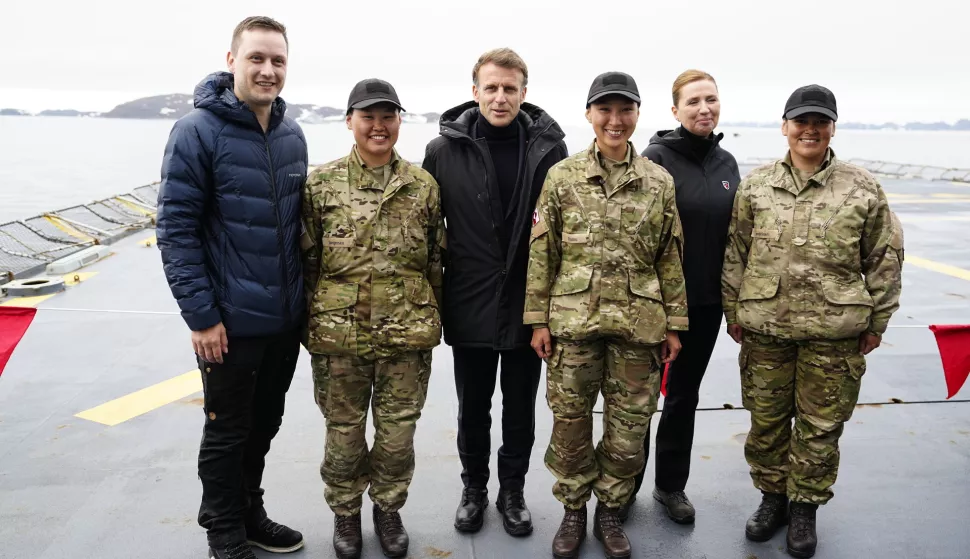 epa12177365 French President Emmanuel Macron (3-L), Danish Prime Minister Mette Frederiksen (2-R), and Greenlandic leader Jens-Frederik Nielsen (L) pose with soldiers aboard the Danish frigate F363 Niels Juel in Nuuk, Greenland, 15 June 2025. EPA/MADS CLAUS RASMUSSEN DENMARK OUT