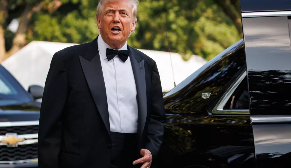 epa12170760 US President Donald J. Trump gestures next to First Lady Melania Trump (not pictured) as he leaves for the opening night of Les Miserables at the Kennedy Center in Washington, DC, USA, on June 11, 2025. EPA/Samuel Corum/Sipa USA