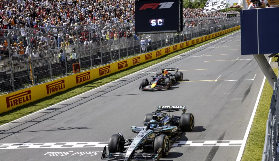epa12177934 Mercedes driver George Russell of Britain (R) crosses the finish line followed by Red Bull Racing driver Max Verstappen of Netherlands during the Formula 1 Grand Prix of Canada at the Circuit Gilles-Villeneuve in Montreal, Canada, 15 June 2025. EPA/SHAWN THEW/POOL