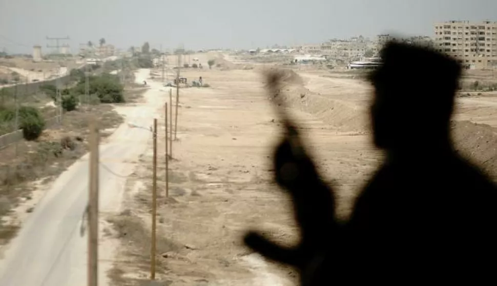 epa06209627 (FILE) - A Hamas security guards is silhouetted while standing guard near the border between Egypt and Gaza Strip in Rafah, southern Gaza Strip, 17 August 2017 (reissued 17 September 2017). Palestinian Islamist Hamas group said on 17 September 2017 it has dissolved its administration that runs Gaza and agrees to hold general elections in order to end a long-running feud with President Mahmoud Abbas's Fatah movement. EPA/HASSAN ALI
