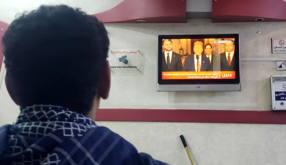 epa12190521 A Yemeni man watches a TV report on the US airstrikes on Iran, in Sanaa, Yemen, 22 June 2025. Yemen's Houthis threatened to attack US ships in the Red Sea if Washington joins Israel's strikes on Iran, according to a statement by Houthi military spokesman Yahya Sarea. The US forces struck three of Iran's key nuclear sites: Natanz, Isfahan and Fordo, US President Trump announced on 21 June. EPA/