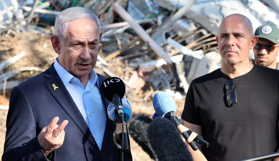 epa12187748 Israel's Prime Minister Benjamin Netanyahu (L) delivers a statement to the press next to Professor Alon Chen (R), President of the Weizmann Institute of Science during a visit to the site of the Weizmann Institute of Science, which was hit by Iranian missiles in the central city of Rehovot, Israel, 20 June 2025. Iran and Israel have been exchanging fire since Israel carried out missile strikes on Iran on 13 June 2025. EPA/JACK GUEZ/POOL
