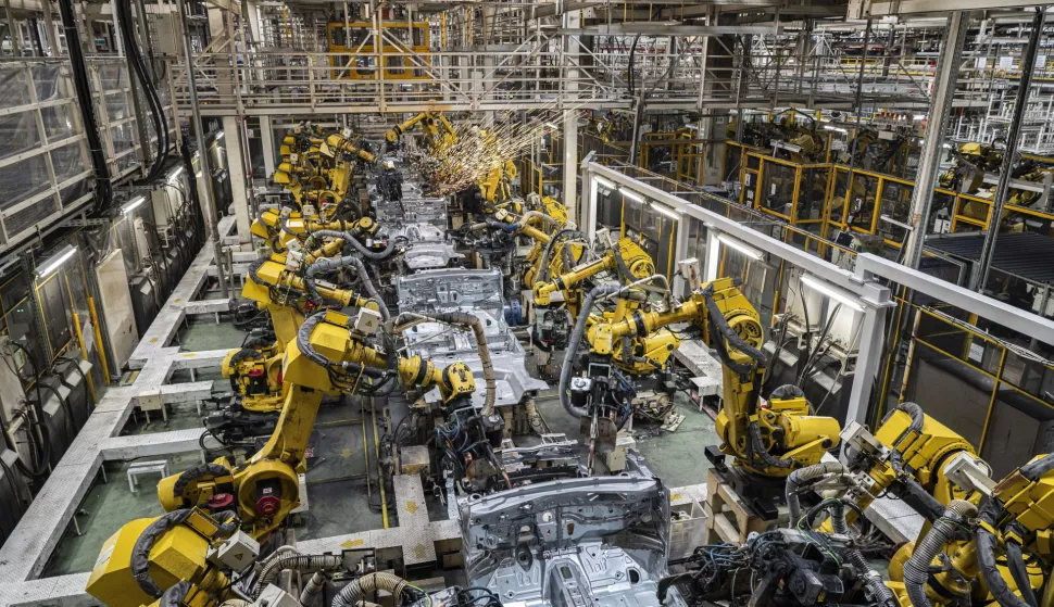 epa11137272 An overall view of the welding line at the factory of Magyar Suzuki Zrt., the Hungarian affiliate of the Japanese company Suzuki Motor Corp., in Esztergom, Hungary, 08 February 2024, as workers celebrated the four millionth car manufactured in the plant. EPA/Zsolt Szigetvary HUNGARY OUT