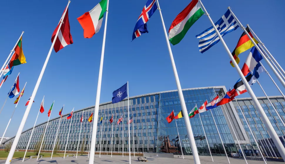 epa12007171 The flag of NATO and its member states flies during a meeting of the North Atlantic Treaty Organization (NATO) Ministers of Foreign Affairs in Brussels, Belgium, 03 April 2025. EPA/OLIVIER MATTHYS