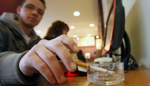 epa01211991 (FILE) A file picture dated 29 December 2007 show a young man smoking a cigarette in a coffee house of Berlin, Germany. Smoking ban in bars and restaurants becomes effective from 01 January 2008 on in the German city state of Berlin and seven more federal states. Overall, eleven of 16 federal states have now a smoking ban installed. EPA/KLAUS-DIETMAR GABBERT