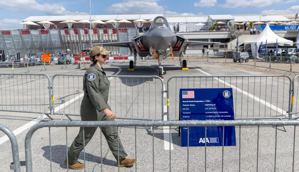 epa12179386 A person in a pilot's suit walks past a A F-35 A Lightning II generation US-made jet fighter on display during the first day of the 55th edition of the International Paris Air Show at the Paris-Le Bourget Airport near Paris, France, 16 June 2025. The Paris Air Show, one of the largest trade fairs of the aerospace-industry and air shows in the world, runs from 16 to 22 June. EPA/CHRISTOPHE PETIT TESSON