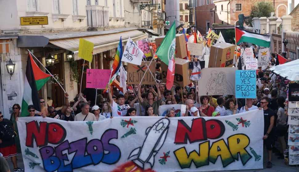epa12203395 People take part in a protest 'No Space for Bezos' a day after the wedding of Jeff Bezos and Lauren Sanchez, in Venice, Italy, 28 June 2025. EPA/ANDREA MEROLA