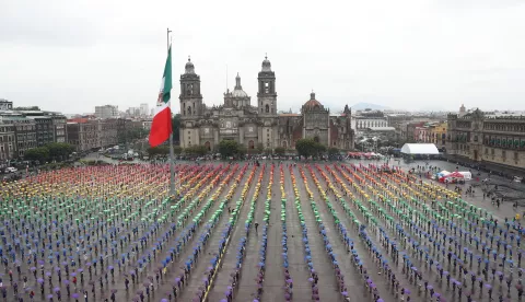 epa12191792 People participate in the formation of a flag as part of 'Pride Week' in the Zocalo of Mexico City, Mexico, 22 June 2025. EPA/Mario Guzman