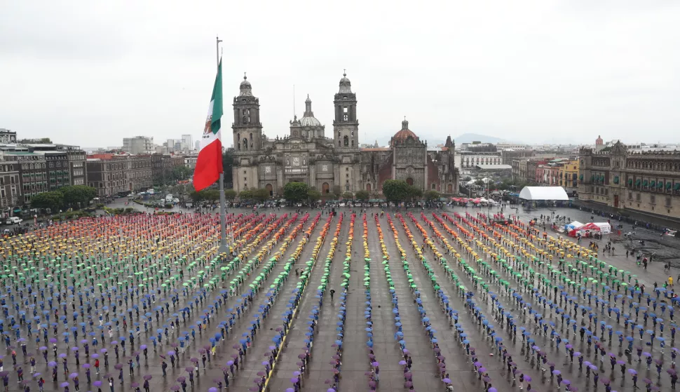 epa12191792 People participate in the formation of a flag as part of 'Pride Week' in the Zocalo of Mexico City, Mexico, 22 June 2025. EPA/Mario Guzman