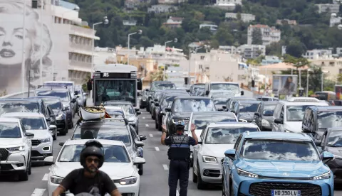epa12130353 A policeman directs traffic following a power outage that hist South of France in Cannes, France, 24 May 2025. A massive power outage struck the French region of Alpes-Maritimes, including Cannes, on 24 May. According to the Cannes Film Festival, the closing ceremony and all scheduled events are to proceed as planned. The Palais des Festivals has its independent power supply. EPA/GUILLAUME HORCAJUELO