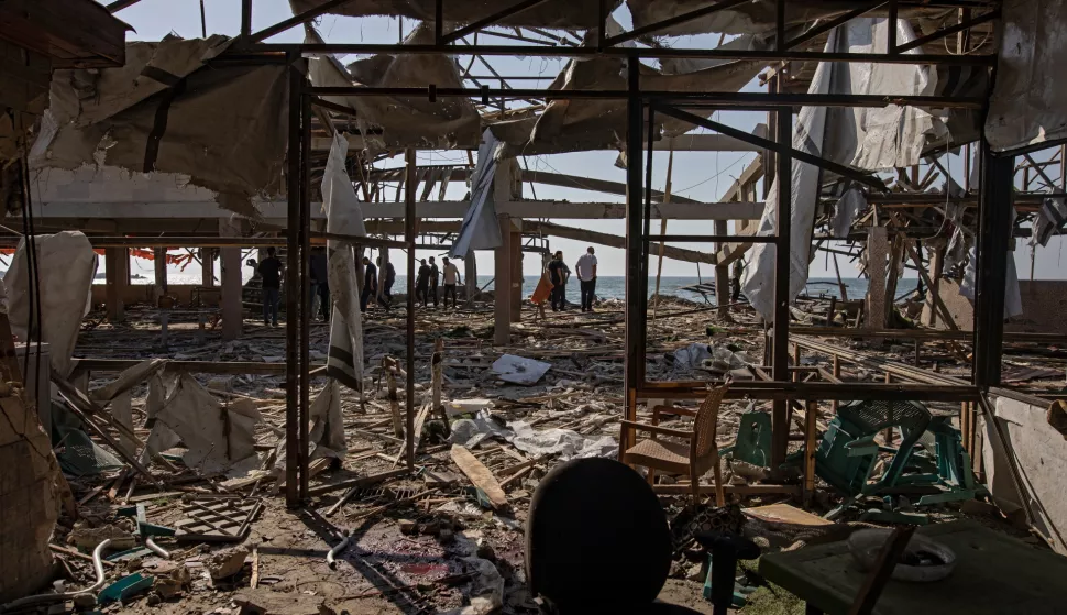 epa12206626 Palestinians inspect the site of an Israeli airstrike that targeted Al-Baqa Cafe, located on the seafront of Gaza City in the western part of the city, 30 June 2025. According to the Gaza Ministry of Health, the strike resulted in the death of 24 Palestinians. EPA/HAITHAM IMAD