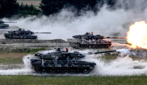 epa06877608 (FILE) - German Army's 'Leopard 2A6' tanks stand on their positions a fire rounds while participating in the 'Strong Europe' Tank Challenge 2018 at the military training area in Grafenwoehr, Germany, 08 June 2018 (reissued 10 July 2018). NATO member countries' heads of states and governments (Belgium, Canada, Denmark, France, Iceland, Italy, Luxembourg, the Netherlands, Norway, Portugal, Britain and the United States) will gather in Brussels, Belgium on 11 and 12 July 2018 for a two days meeting. EPA/FILIP SINGER *** Local Caption *** 54392757