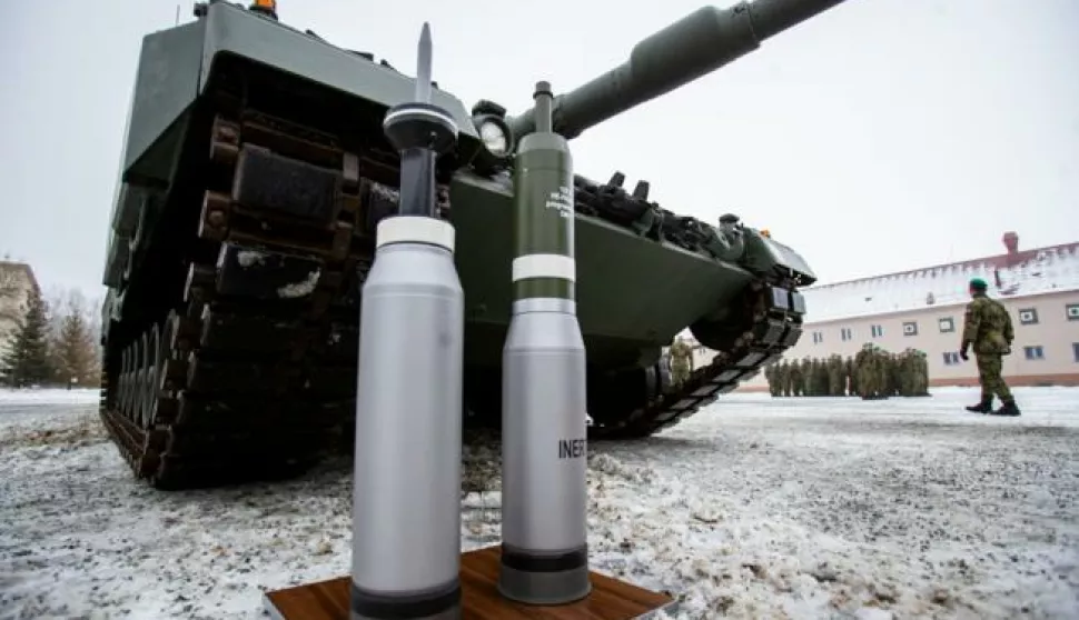 epa10375564 Ammunition standing in front of a Leopard 2A4 tank during a ceremony for the hand over of the symbolic key of the tank to the Czech army, in Praslavice, Czech Republic, 21 December 2022. The Czech Republic is to receive a total of 14 Leopard 2A4 tanks and a Bueffel armored recovery vehicle as a gift from Germany under the German government's 'Ringtausch' programme in return for deliveries of older tanks from Czech army depots to Ukraine. In addition to the tanks, the delivery will include an initial package of spare parts, ammunition and a three-year service support from the supplier, which includes training of Czech soldiers. The value of the donation exceeds 3.85 billion Czech crown (159 million euro). The rest of the military equipment is expected to be delivered to the Czech Republic next year. EPA/VLADIMIR PRYCEK