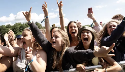 epaselect epa12201340 Festival-goers reacts during the concert of Danish singer Christopher at the Tinderbox festival in Odense, Denmark, 27 June 2025. The music event runs from 26 to 28 June 2025. EPA/HELLE ARENSBAK DENMARK OUT