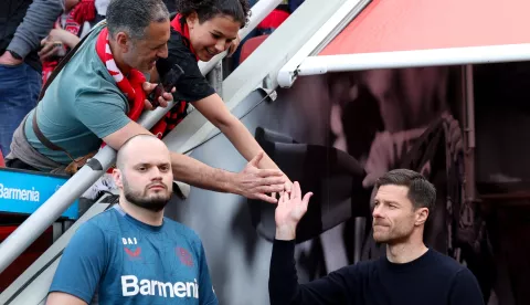 epa11278402 Leverkusen's head coach Xabi Alonso (R) arrives for the German Bundesliga soccer match between Bayer 04 Leverkusen and SV Werder Bremen in Leverkusen, Germany, 14 April 2024. EPA/CHRISTOPHER NEUNDORF CONDITIONS - ATTENTION: The DFL regulations prohibit any use of photographs as image sequences and/or quasi-video.