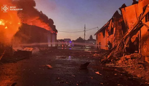 epa12219548 A handout photo made available by the State Emergency Service shows Ukrainian rescuers working at the site of a shelling following Russian drone attacks in the Kyiv area, Ukraine, 06 July 2025. At least two people died and a dozen more were injured after Russian forces launched an overnight attack across Ukraine with at least 150 drones, according to the National Police. EPA/STATE EMERGENCY SERVICE HANDOUT HANDOUT EDITORIAL USE ONLY/NO SALES