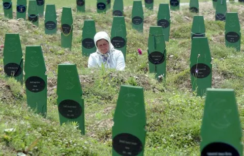 epa06052291 (FILE) - Moslem Fatima Selimovic visits the grave of her brother Fajko Smajic, who was killed in Srebrenica in 1995 by Serb forces, in Potocari near Srebrenica, on Sunday 26 June 2005. Media reports on 27 June 2017 state that the Dutch Appeals Court in The Hague have ruled that Dutch peacekeepers were only partly responsible for about 300 deaths in the 1995 Srebrenica massacre when they allowed Bosnian Serbs to seize control of Muslim men seeking shelter in a UN safe haven foolwing the court challenge by the Mothers of Srebrenica. In the 1992-95 war in Bosnia, Dutch lightly-armed peacekeepers who were in Srebrenica, to protect the town from Bosnian Serbs, capitulated and some 8,000 Muslim Bosniak boys and men were massacred. EPA/MZWELE