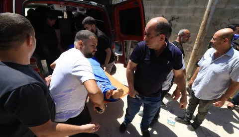 epa12214903 Relatives carry the body of a Palestinian man during the funeral in the West Bank city of Tulkarem, 04 July 2025. According to the Palestinian Ministry of Health, a 61-year-old man identified as Waleed Hassan Saad Bdeir, was fatally shot by Israeli troops on 03 July evening near Nour Shams refugee camp. EPA/ALAA BADARNEH