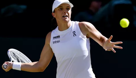 epa12233999 Iga Swiatek of Poland in action during the Women's Singles final match against Amanda Anisimova of the USA at the Wimbledon Championships, Wimbledon, Britain, 12 July 2025. EPA/TOLGA AKMEN EDITORIAL USE ONLY