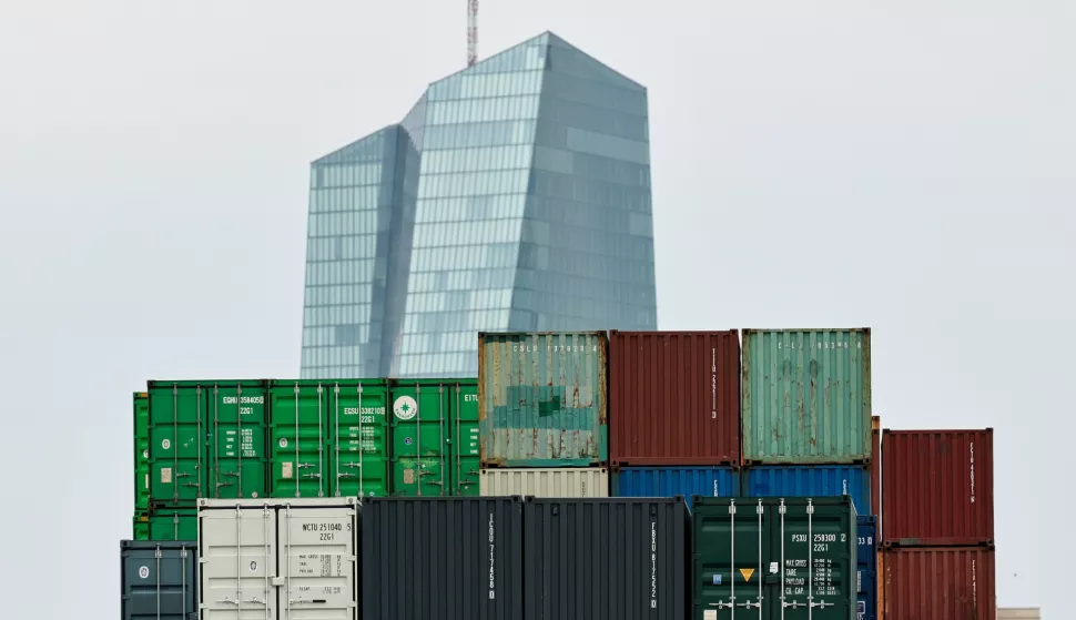 epa12237083 The building of the European Central Bank (ECB) seen behind a transshipment station for containers in Frankfurt am Main, Germany, 14 July 2025. US President Trump announced plans for the United States to impose a 30 percent import duty on products from the European Union (EU) from 01 August 2025. EPA/RONALD WITTEK