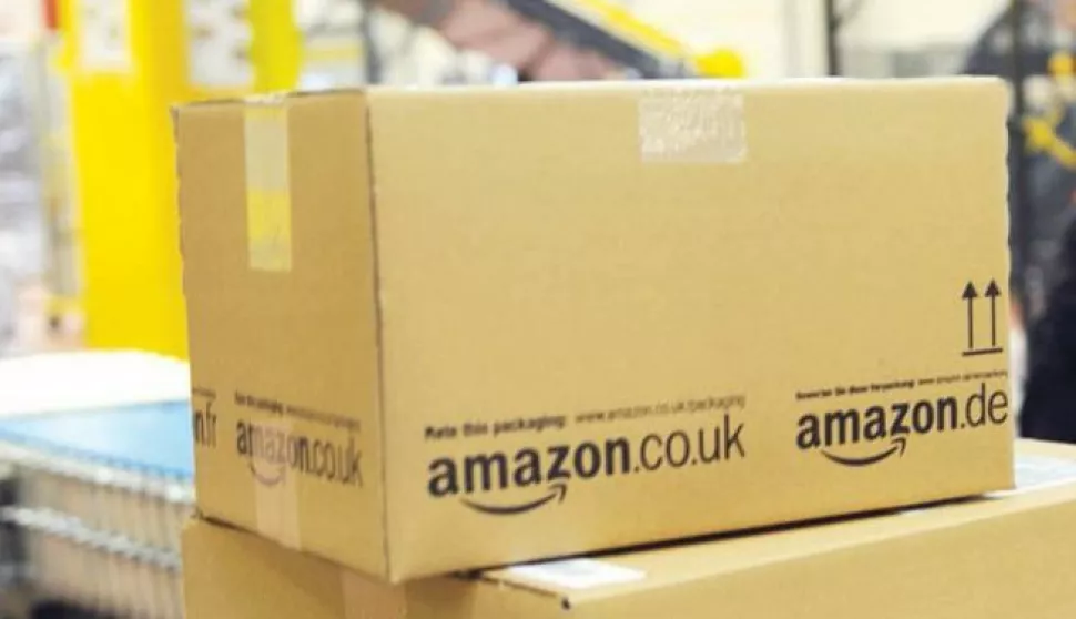 epa04335624 (FILE) A file photo dated 20 December 2010 showing an employee of the online-retailer Amazon putting packages onto a conveyor band at the logistics centre in Bad Hersfeld, Germany. Amazon, the world's biggest online retailer, announced 30 July 2014 that it will invest an additional 2 billion dollars to expand in India, where competition is heating up. The move came a day after Flipkart, India's largest online retailer, announced that it had raised a record 1 billion dollars, the most ever by an Indian internet company in a single round.Amazon said its investment would support its rapid growth and enhance the customer and seller experience in India.Amazon launched its India operations in June 2013. EPA/UWE ZUCCHI