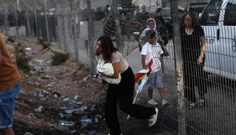epa12241650 Druze people from Golan and Galilee gather at the ceasefire line, trying to cross the buffer zone to enter Syria, near the Village of Majdal Shams, in the Golan Heights, 16 July 2025. The Israel Defense Forces confirmed carrying out airstrikes on the Syrian Defense Ministry in Damascus on 16 July, following the deployment of Syrian troops in the predominantly Druze province of Suwayda (Sweida), after clashes between Druze fighters and Bedouin tribes resulted in the death of dozens of people. The Syrian Defense Minister announced a ceasefire on July 15 in the city of As Suwayda, which Syrian troops entered in the morning, but the area is witnessing violent clashes between government forces and Druze militants. EPA/ATEF SAFADI