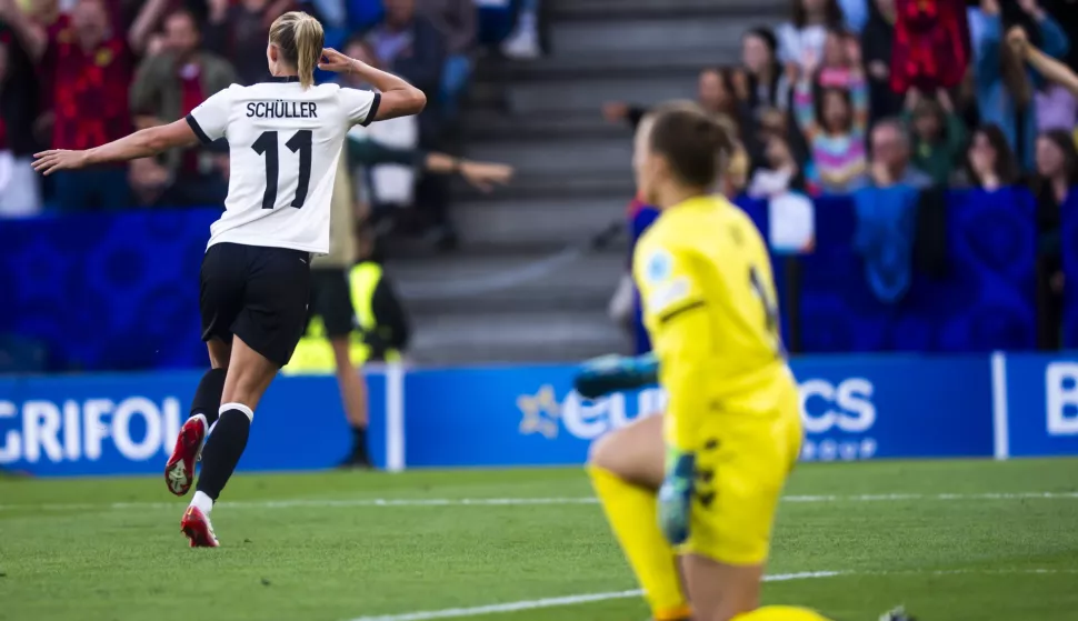 epa12225206 Germany's Sjoeke Nuesken (L) celebrates scoring the 1-1 goal from the penalty spot against Denmark's goalkeeper Maja Bay Ostergaard during the UEFA Women's EURO 2025 Group C soccer match between Germany and Denmark, in Basel, Switzerland, 08 July 2025. EPA/TIL BUERGY EDITORIAL USE ONLY