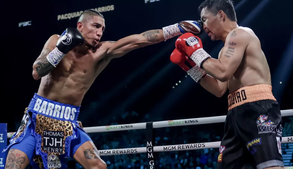 epa12248717 Mario Barrios (L) of the USA in action against Manny Pacquiao (R) of the Philippines during their WBC Welterweight Championship bout at the MGM Grand Garden Arena in Las Vegas, Nevada, USA, 19 July 2025. EPA/ALLISON DINNER
