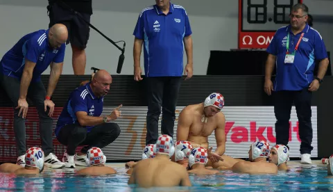 epa12237290 Croatia Head Coach Tucak Ivica (2-L) talks to his players during the men's water polo match between Montenegro and Croatia at the World Aquatics Championships Singapore 2025 in Singapore, 14 July 2025. EPA/FAZRY ISMAIL