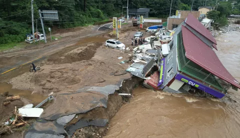epa12248903 A destroyed CU convenience store outlet operated by BGF Retail Co. is inundated following heavy rain in Gapyeong, Gyeonggi Province, South Korea, 20 July 2025. EPA/YONHAP SOUTH KOREA OUT