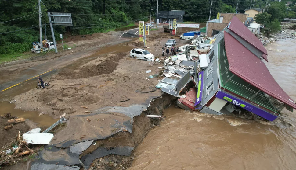 epa12248903 A destroyed CU convenience store outlet operated by BGF Retail Co. is inundated following heavy rain in Gapyeong, Gyeonggi Province, South Korea, 20 July 2025. EPA/YONHAP SOUTH KOREA OUT