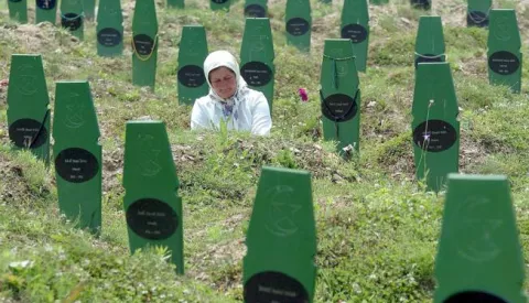 epa06052291 (FILE) - Moslem Fatima Selimovic visits the grave of her brother Fajko Smajic, who was killed in Srebrenica in 1995 by Serb forces, in Potocari near Srebrenica, on Sunday 26 June 2005. Media reports on 27 June 2017 state that the Dutch Appeals Court in The Hague have ruled that Dutch peacekeepers were only partly responsible for about 300 deaths in the 1995 Srebrenica massacre when they allowed Bosnian Serbs to seize control of Muslim men seeking shelter in a UN safe haven foolwing the court challenge by the Mothers of Srebrenica. In the 1992-95 war in Bosnia, Dutch lightly-armed peacekeepers who were in Srebrenica, to protect the town from Bosnian Serbs, capitulated and some 8,000 Muslim Bosniak boys and men were massacred. EPA/MZWELE
