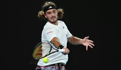 epa10426279 Stefanos Tsitsipas of Greece hits a forehand in his quarter final match against Jiri Lehecka of the Czech Republic at the Australian Open tennis tournament in Melbourne, Australia 24 January 2023. EPA/LUKAS COCH AUSTRALIA AND NEW ZEALAND OUT