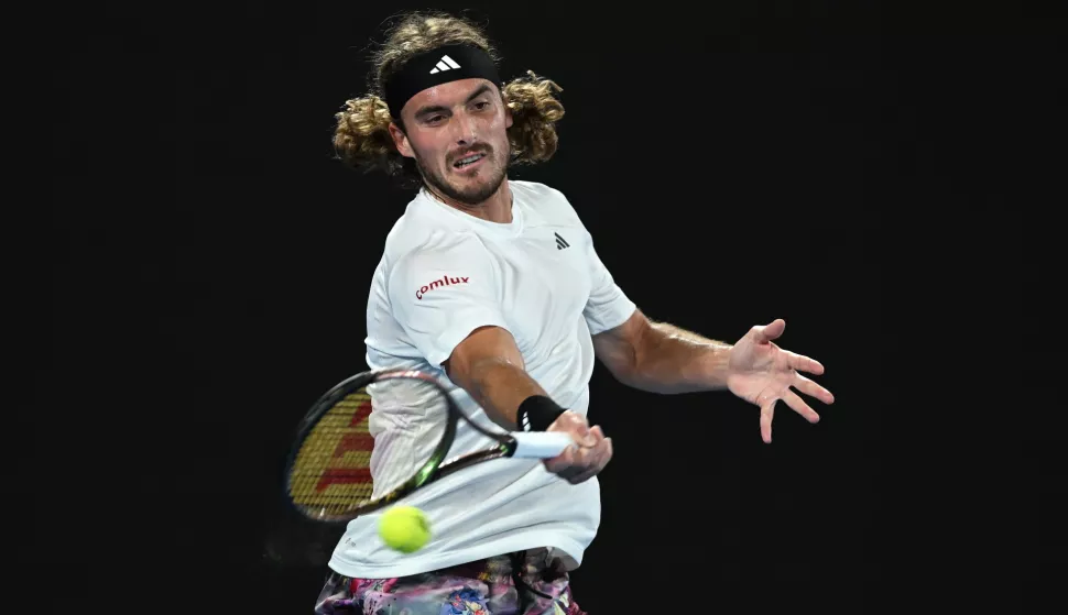 epa10426279 Stefanos Tsitsipas of Greece hits a forehand in his quarter final match against Jiri Lehecka of the Czech Republic at the Australian Open tennis tournament in Melbourne, Australia 24 January 2023. EPA/LUKAS COCH AUSTRALIA AND NEW ZEALAND OUT