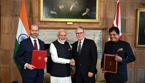 epa12258155 (L-R) British Business and Trade Secretary Jonathan Reynolds, India's Prime Minister Narendra Modi, British Prime Minister Keir Starmer and Indian Commerce and Industry Minister Piyush Goyal pose during a press conference after signing a free trade agreement at the Chequers Estate, the UK prime minister's country residence, near Aylesbury, Britain, 24 July 2025. The long-awaited free trade agreement between the UK and India would boost the British economy by 4.8 billion GBP (6.5 billion US dollars) a year, the UK government said. EPA/CHRIS J. RATCLIFFE/POOL