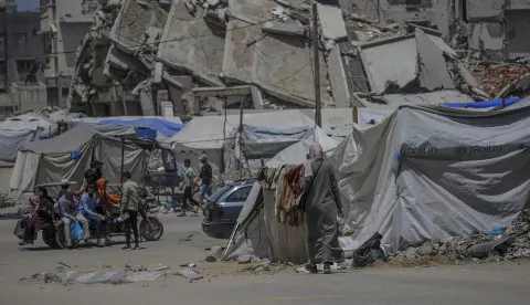 epa12092651 Internally displaced Palestinians who fled from the east of Gaza City and northern Gaza Strip move in the streets of Gaza City on, 11 May 2025. More than 51,000 Palestinians have been killed in the Gaza Strip, according to the Palestinian Ministry of Health, since Israel launched a military campaign in the strip in response to a cross-border attack led by the Palestinian militant group Hamas on 07 October 2023, in which about 1,200 Israelis were killed and more than 250 taken hostage. EPA/MOHAMMED SABER