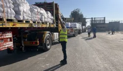 epa12265268 Trucks loaded with humanitarian aid cross the Rafah border gate, between Egypt and the Gaza Strip, in Rafah, Egypt, 27 July 2025. The Israeli army declared a 'tactical pause' in military operations in parts of the Gaza Strip on 27 July, to facilitate the safe passage of humanitarian aid convoys. EPA/STRINGER